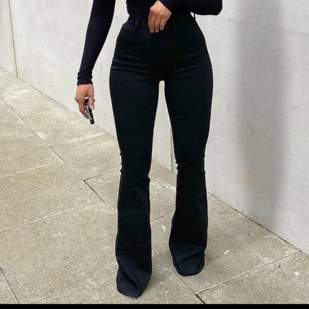 Black flared Fashion Nova dress never worn brand new with tag .